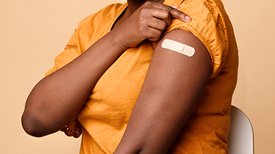 closeup of black woman arm with bandaid