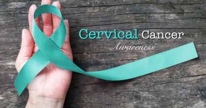 teal ribbon in woman's hand with Cervical Cancer Awareness text