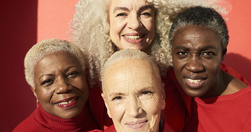 Four women wearing red shirts