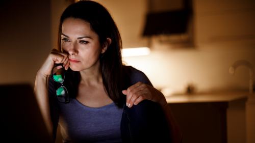 Woman looking intensely at her laptop.