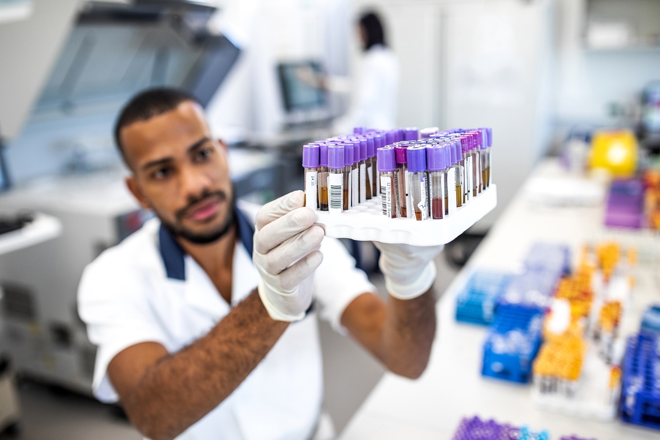 Scientist working in the laboratory, holding test tubes