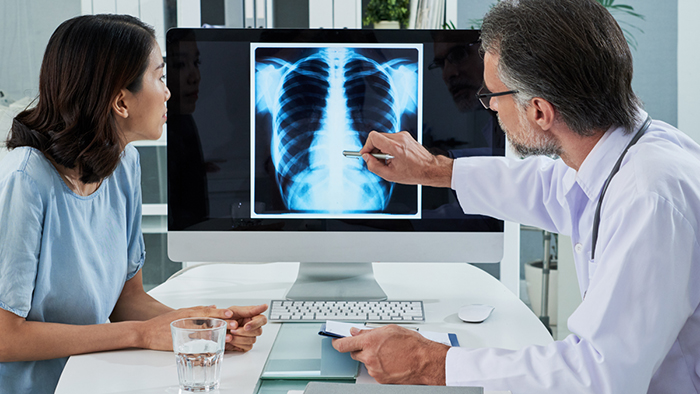 Doctor and patient looking at x-rays