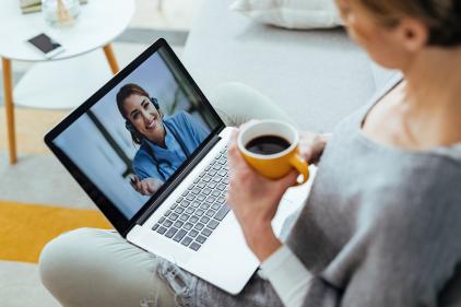 Woman watching program on laptop