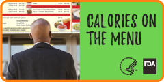 Man looking at menu board with calories featured on the menu