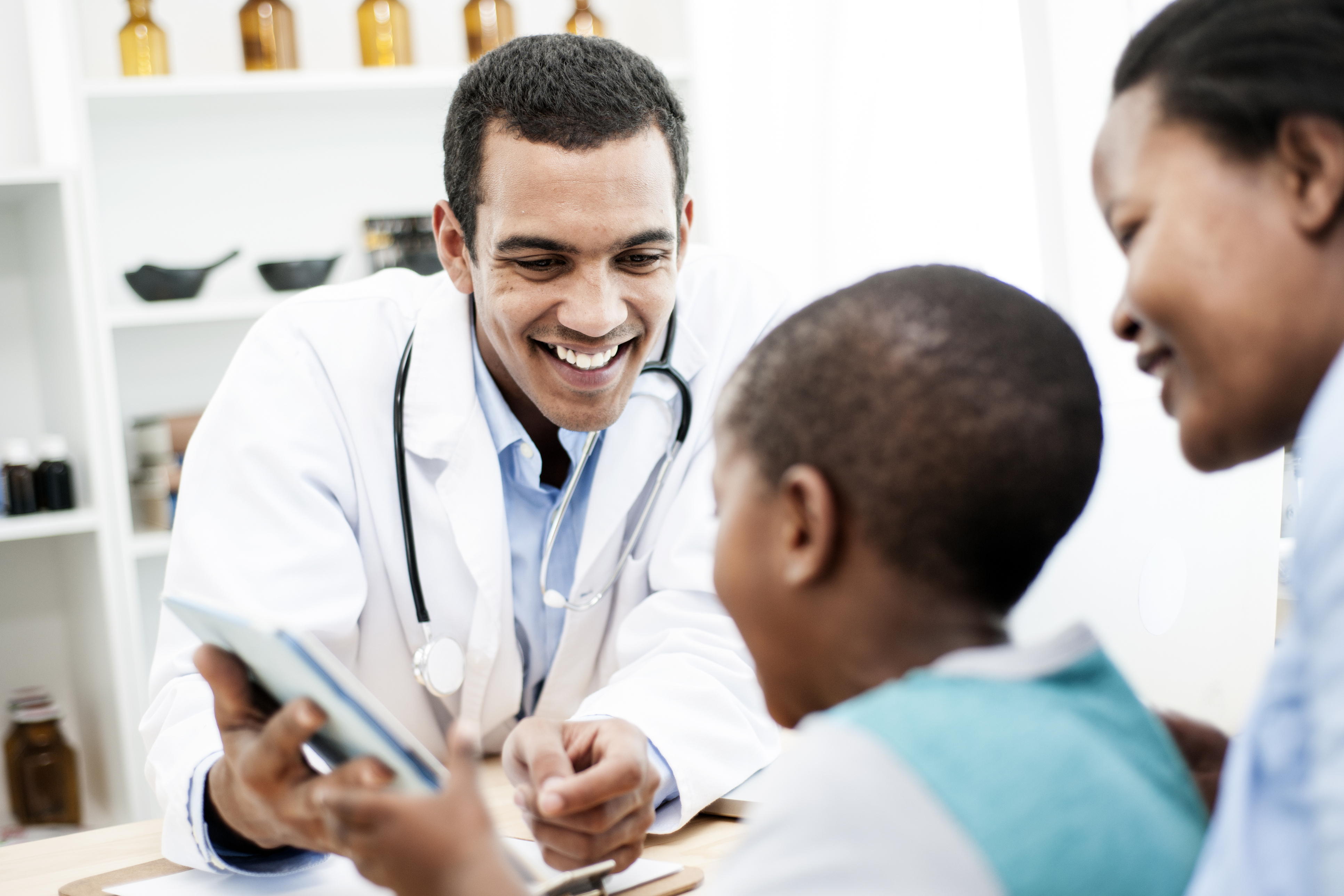 African American Doctor talking to patients