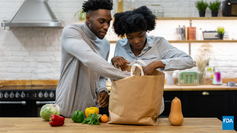 Couple unpacking groceries