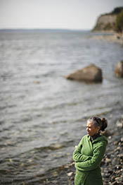 Mature woman standing on the beach