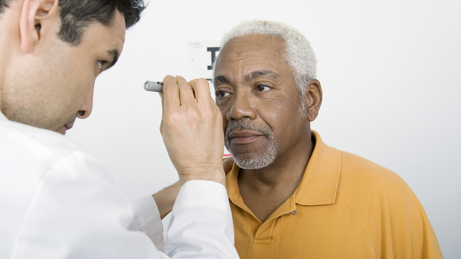 doctor looking in patient's eye