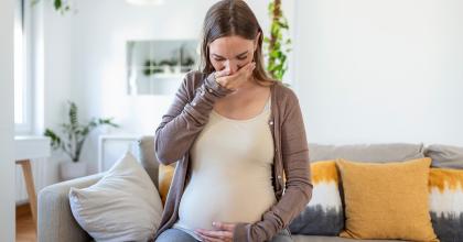 Image of pregnant woman gagging 