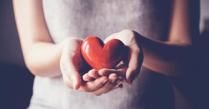 Woman holding a heart in hands