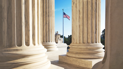 Image of columns with American flag, representing U.S. government collaborations