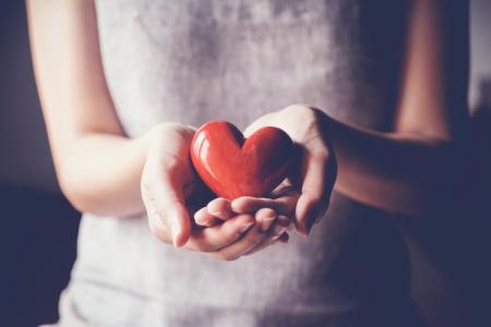 Woman Holding Heart