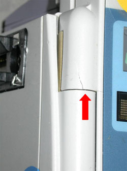 In the photo, a hairline crack in the hinge is clearly visible.