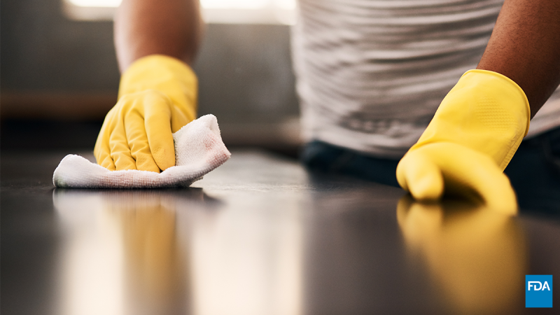 Person wiping table