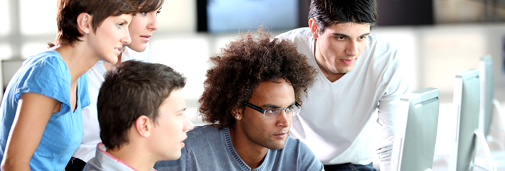 Colleagues looking at a computer screen together