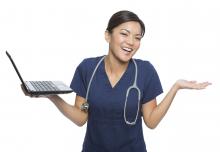 Nurse holding a computer