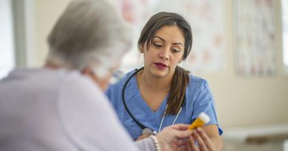 Patient and doctor discussing prescriptions.