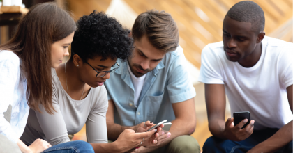 Gathering of diverse people on their phones