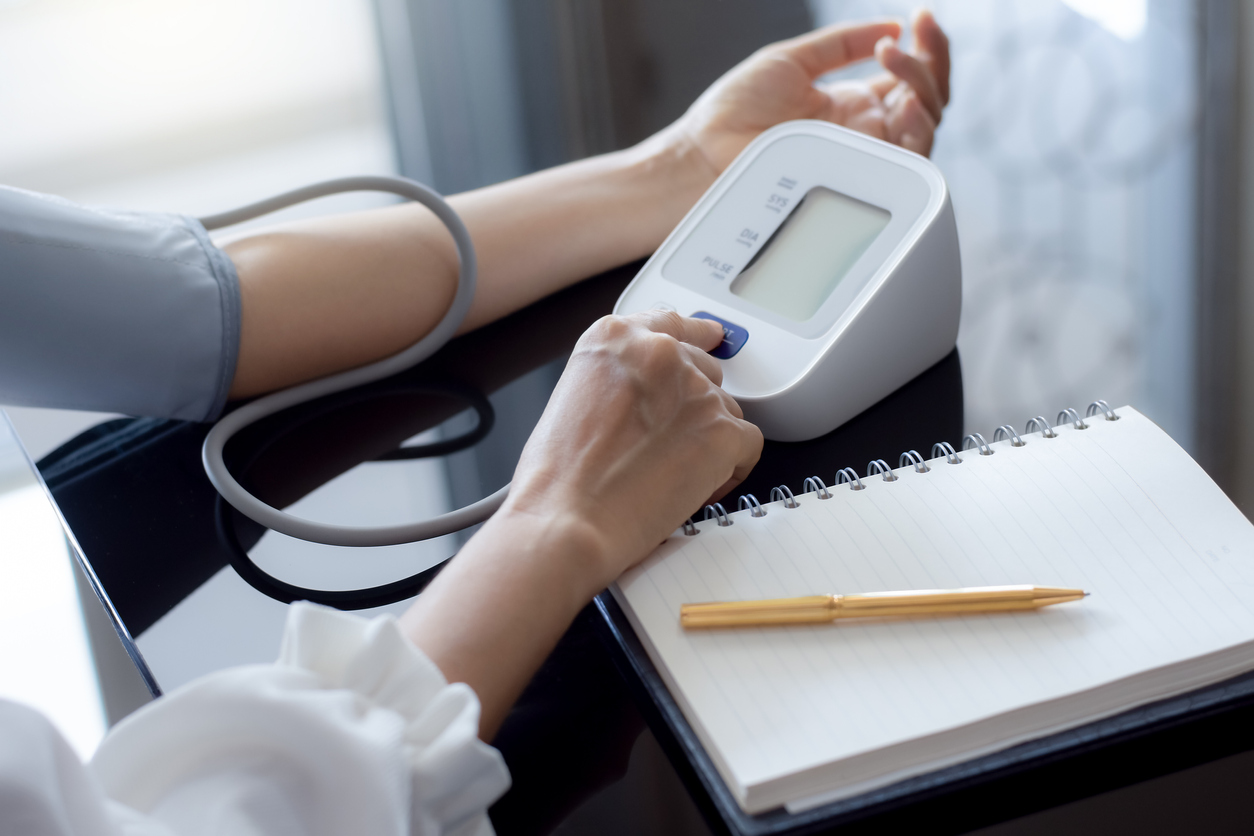 Woman Taking Blood Pressure