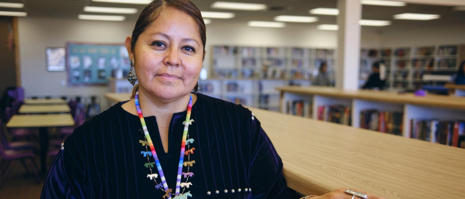 High school teacher in a library