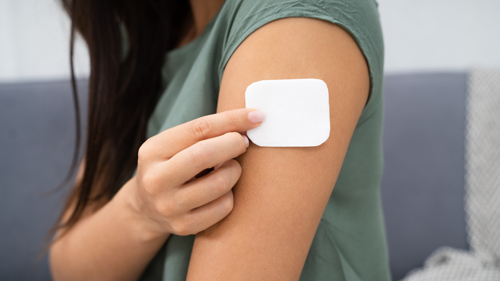 woman with nicotine patch on arm