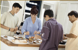 food ingredients additives and colors - family prepares meal in kitchen
