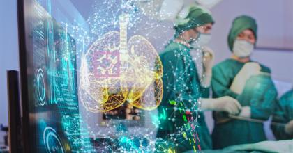 Digital rendering of lungs superimposed over an image of two surgeons looking at a screen.