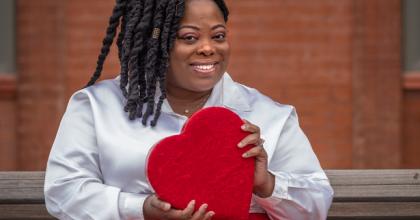 African American Woman Holding Heart
