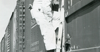 black and white image of Mary Margaret Richardson on ladder