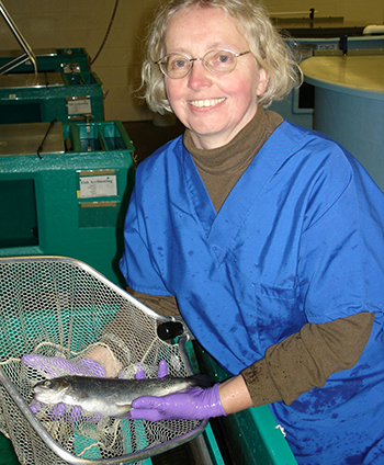 Renate Reimschuessel holding trout at CFSAN lab (350x424)