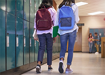 Students walking through hallway