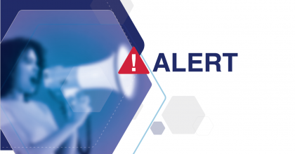 Graphic with white background and the word Alert over it. To the left Alert is an image of a woman speaking through a megaphone.