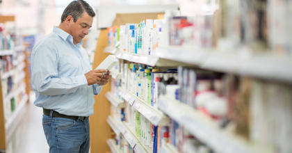 Picture of a middle-aged man shopping for medications at a pharmacy