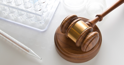 Gavel and test tubes, representing regulatory and scientific components of the Medical Countermeasures Initiative