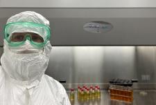 Diane Gowned in Cleanroom for Sterility Testing of Bandages Insulin Syringes 