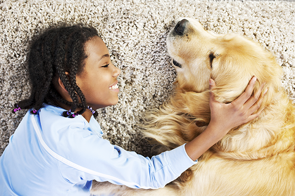 Girl with dog on carpet (600x300)