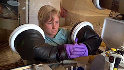 Scientist processing Ebola virus disease samples at Donka Hospital in Conakry, Guinea as part of the EVIDENT project. (Credit: EVIDENT)