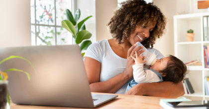 Mother feeding baby a bottle