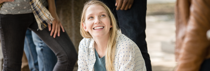 A young blonde woman smiling