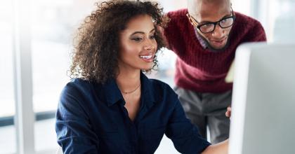 Woman and man watching a CDRH Learn module on their computer 