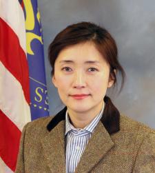 Woman posing in front of American Flag