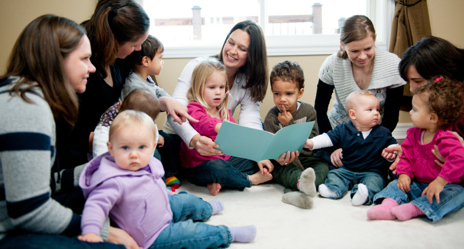 A group of mothers with their infants and toddlers.