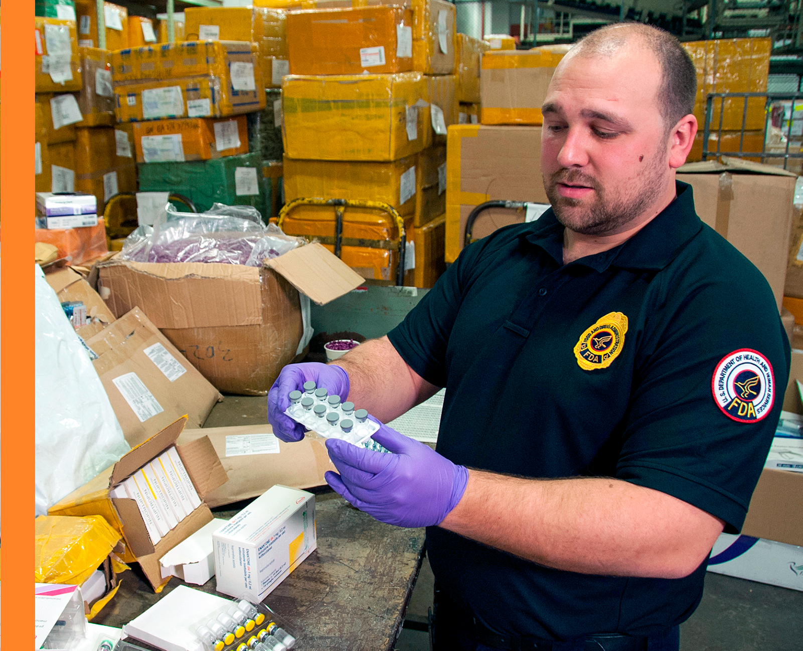 FDA inspector examines pharmaceuticals in a warehouse location