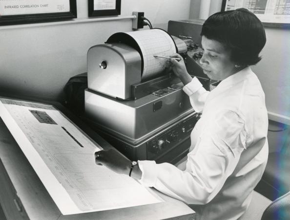 Alma Hayden reviewing spectrographic tracing, c. 1963 (FDA History Office)
