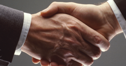 image of a hand shake, symbolising collaboration