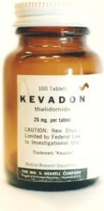 color photo of Kevadon bottle brown glass with white metal cap; black and white label