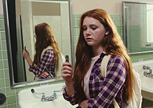 Girl vaping in bathroom