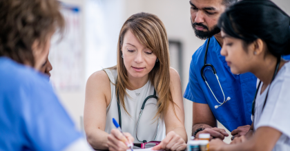 Image of a group of medical professionals having a meeting.