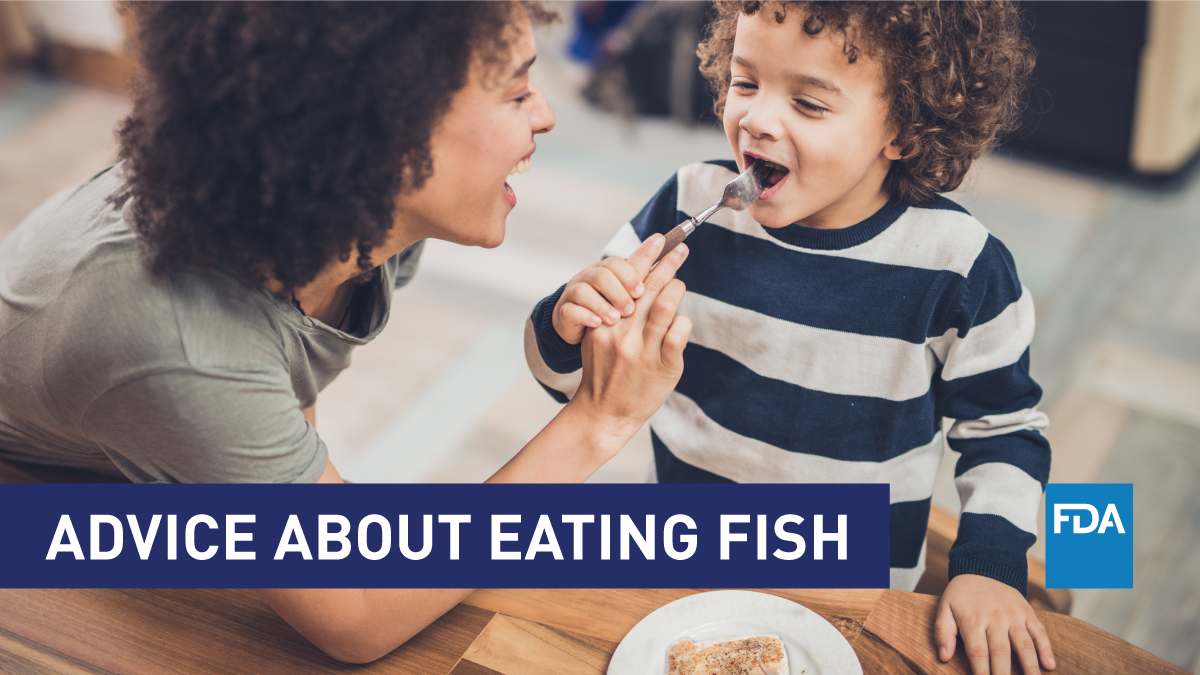Advice About Eating Fish (mom feeding child fish)