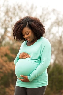 Pregnant Woman in Green 